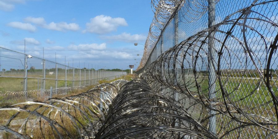 prison-fence-ga29e9fb50_1920